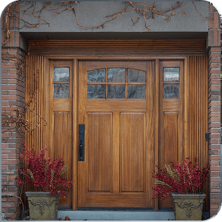 Elegant wooden front door with decorative glass panels
